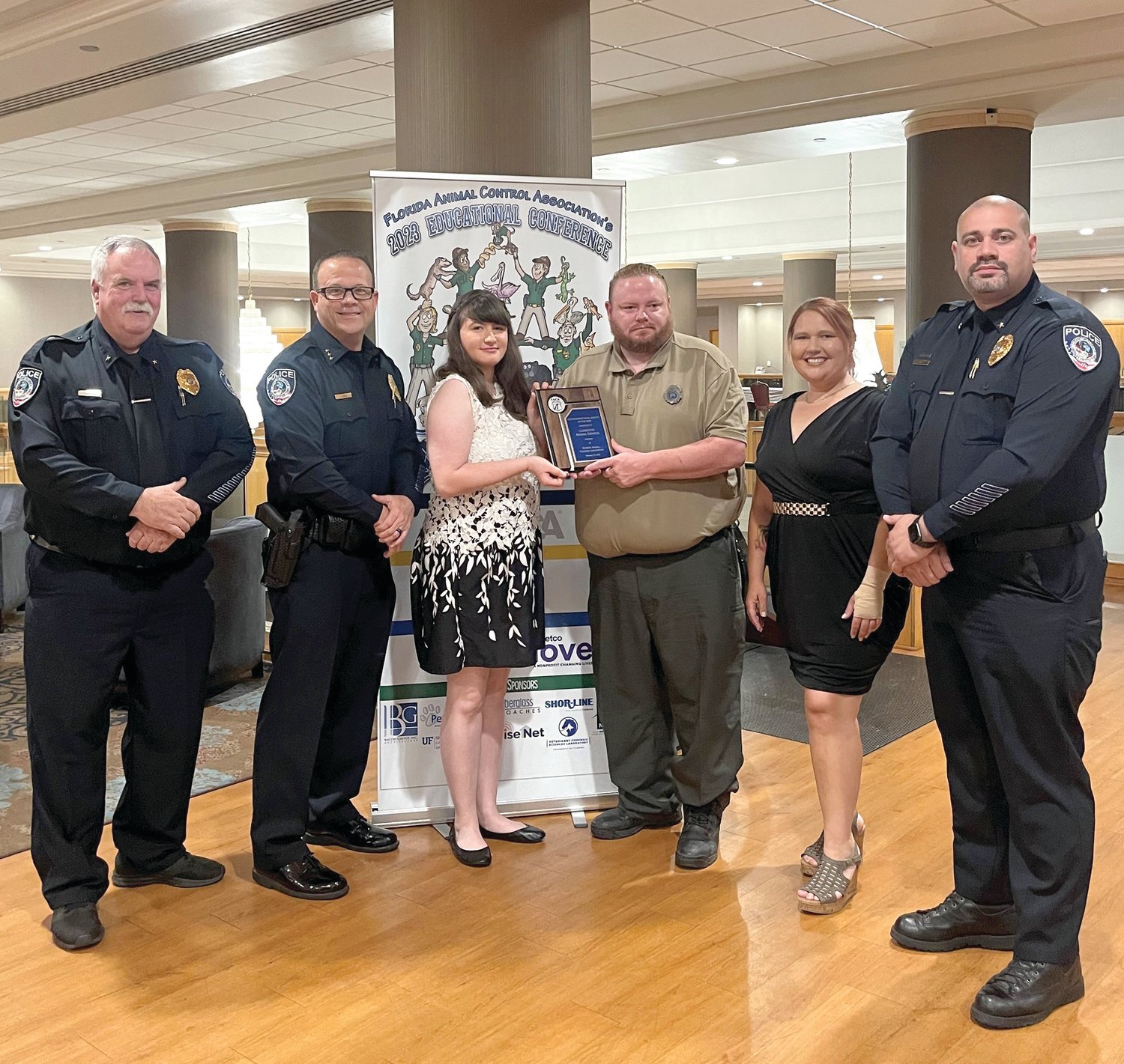 Left to right: Commander Dan Brophy, Chief Tom Lewis, Kennel Tech Abigail Colston, Animal Control Officer Will Jones, Volunteer Heather Price-Hernandez, and Commander Tito Nieves accepted the Outstanding Small Agency of the Year award for the Clewiston Animal Services.